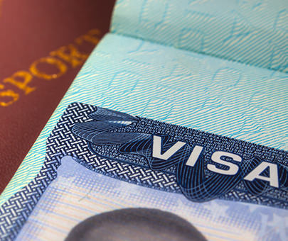 Closeup of a visa and passport.