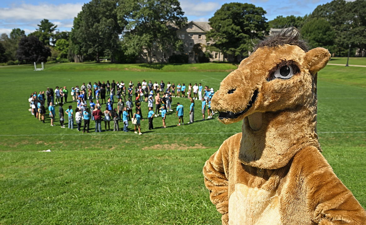 The Camel mascot looks on as new students gather on Tempel Green.