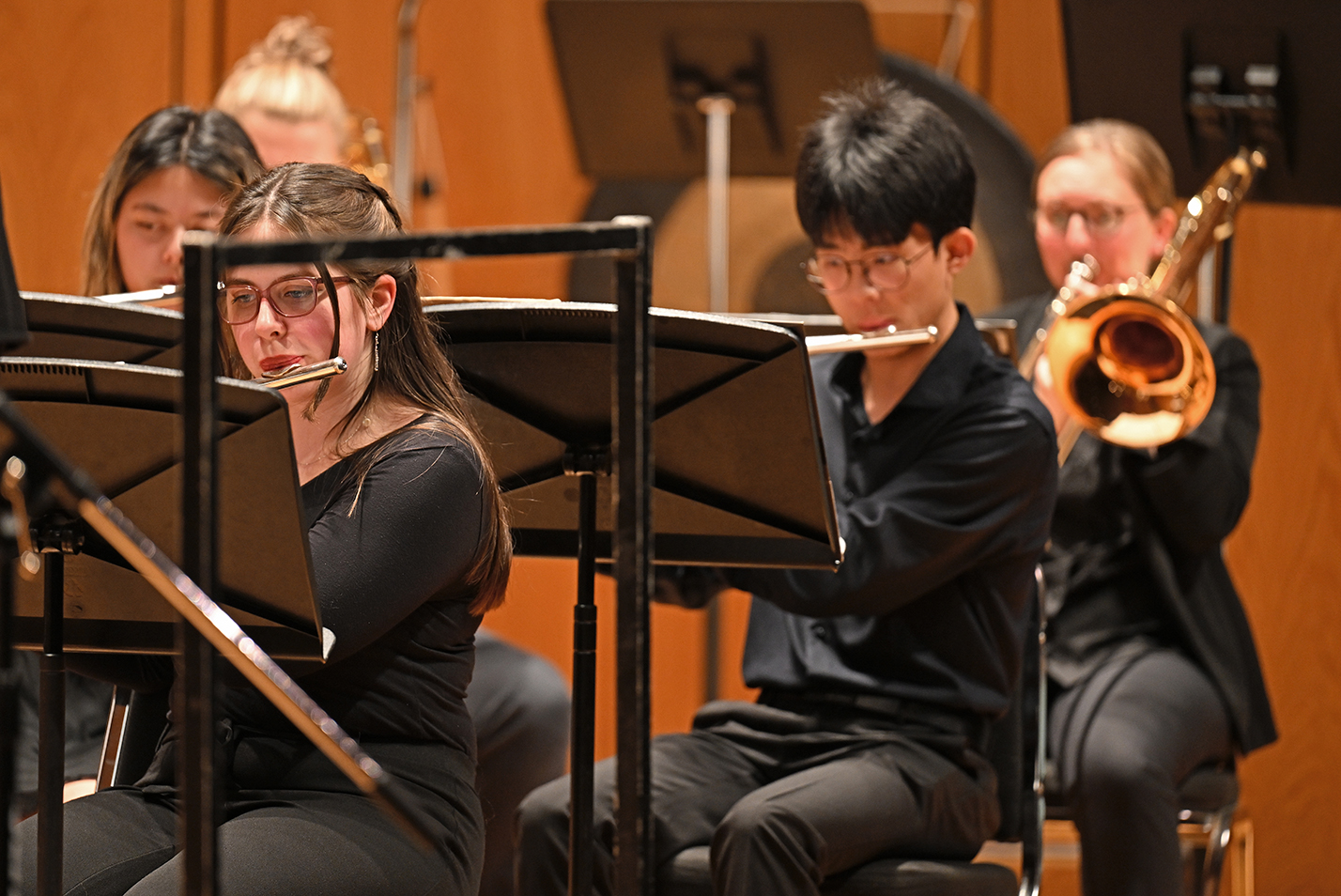 Student musicians play on stage.